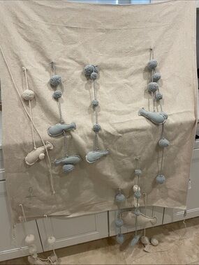 100% cotton Lorena Canals Neutral and Light Blue Pom-Pom Fish Hanging Wall Decor
